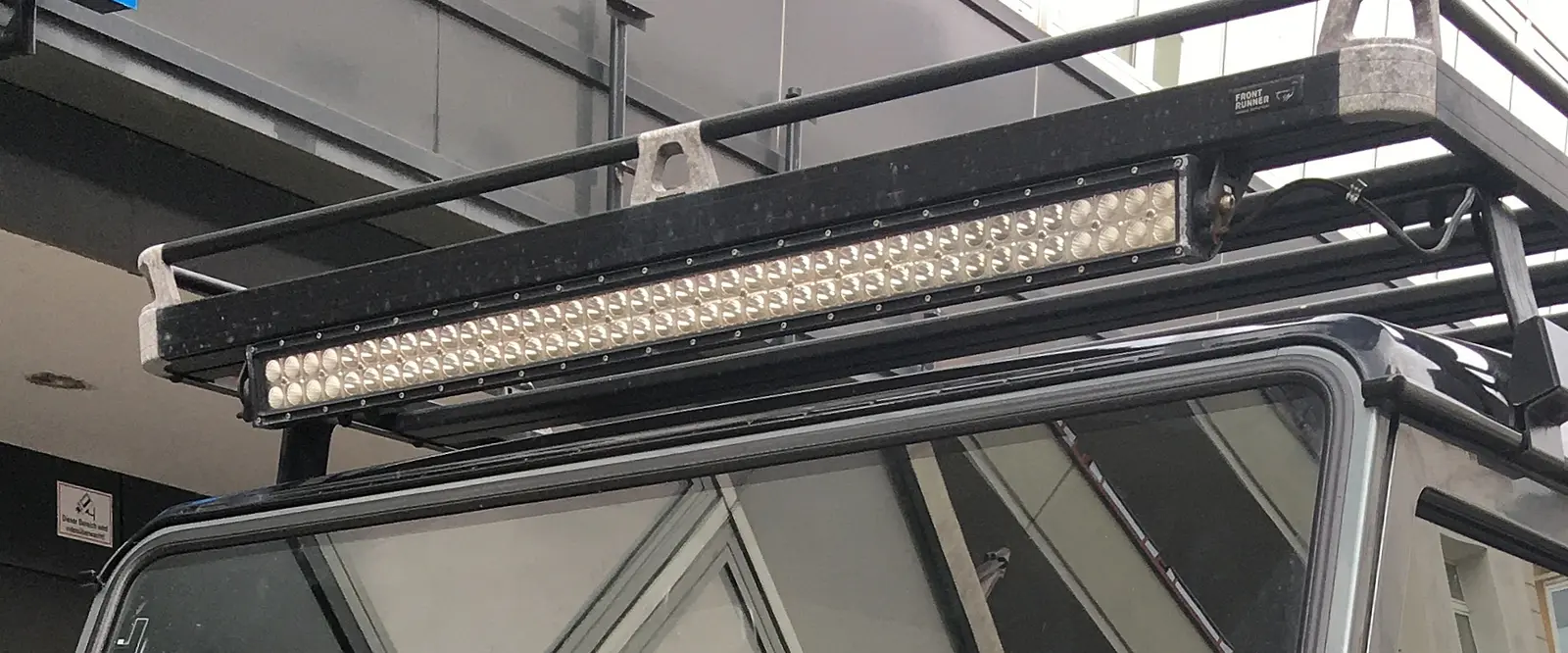 Land Rover Defender 110 (L316) with auxiliary broad LED lightbar for off-road use.jpg